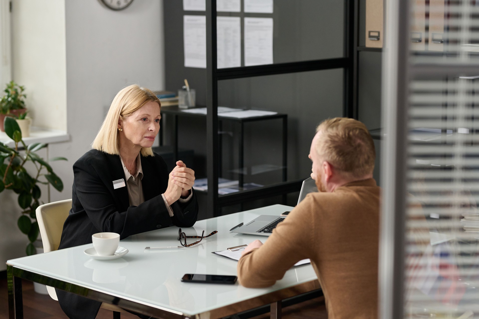 Portrait of caring social worker consulting man